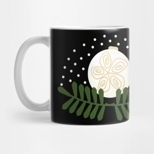 Christmas ornament on mistletoe and snow Mug